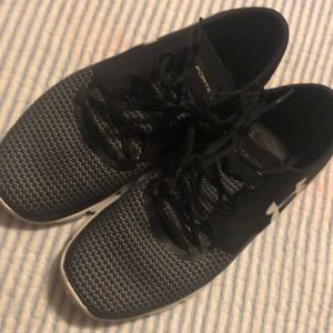 Under Armour charged speed form running shoes.